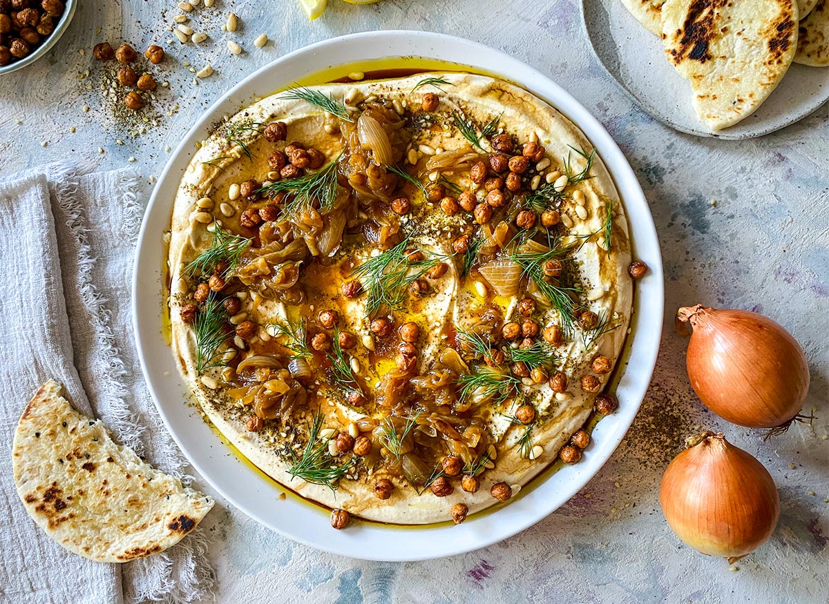 Hummus with Caramelised Onions, Crispy Chickpeas, Pine nuts