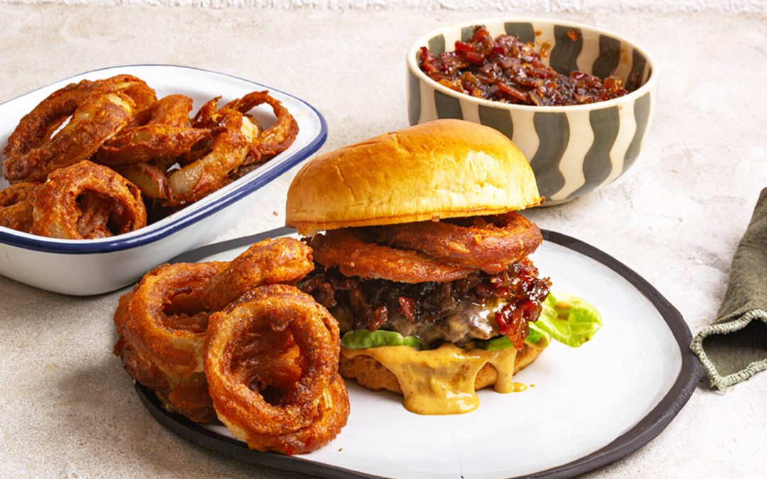 Burger with onion rings and bacon and onion jam